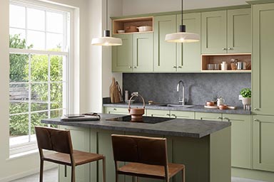 Options kitchen worktops from Bushboard: reed green cupboard fronts.
