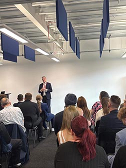 Chief executive of the Federation of Master Builders, Brian Berry, speaking to an audience at Shooters Hill Sixth Form College.