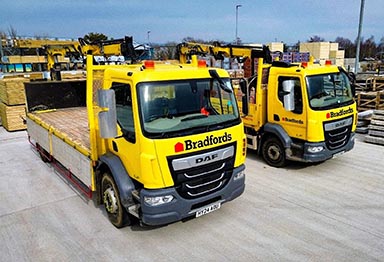 Two Bradfords lorries waiting to be loaded with product.