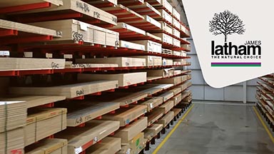 Panels stored on racking with a James Latham logo also in the image.