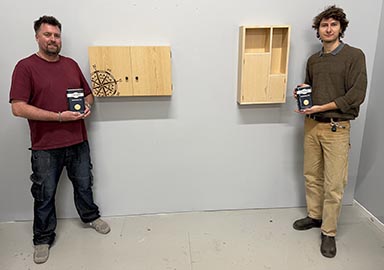 Left to right with the cabinets they made: winner Piers Reid and runner-up Will Franklin.