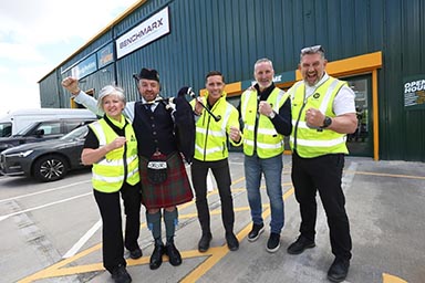 Staff outside the fourth Travis Perkins Glasgow branch.