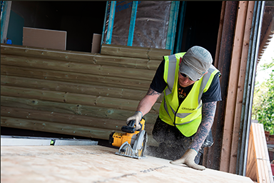 A joiner working with wood.