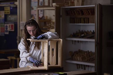 A student working on a joinery project.